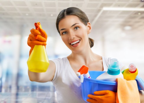 Professional carpet cleaner in Clapham deep cleaning a home carpet