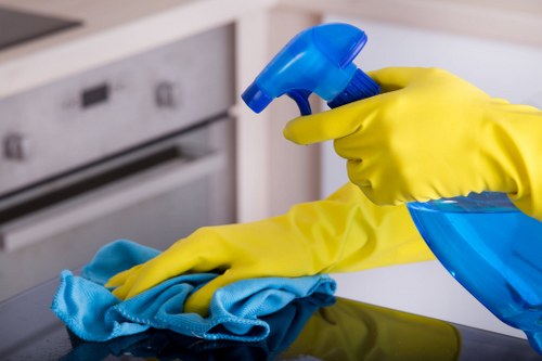 Staff member following safe carpet cleaning procedures