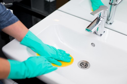 Local carpet cleaner preparing a room for professional treatment in Clapham