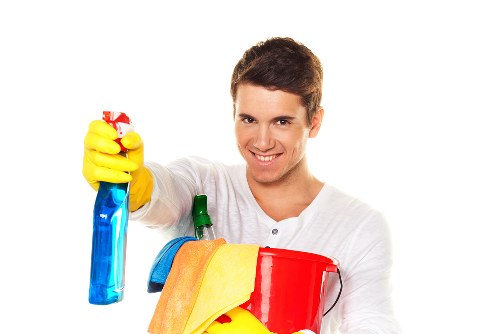Deep cleaning a fabric sofa with specialist equipment